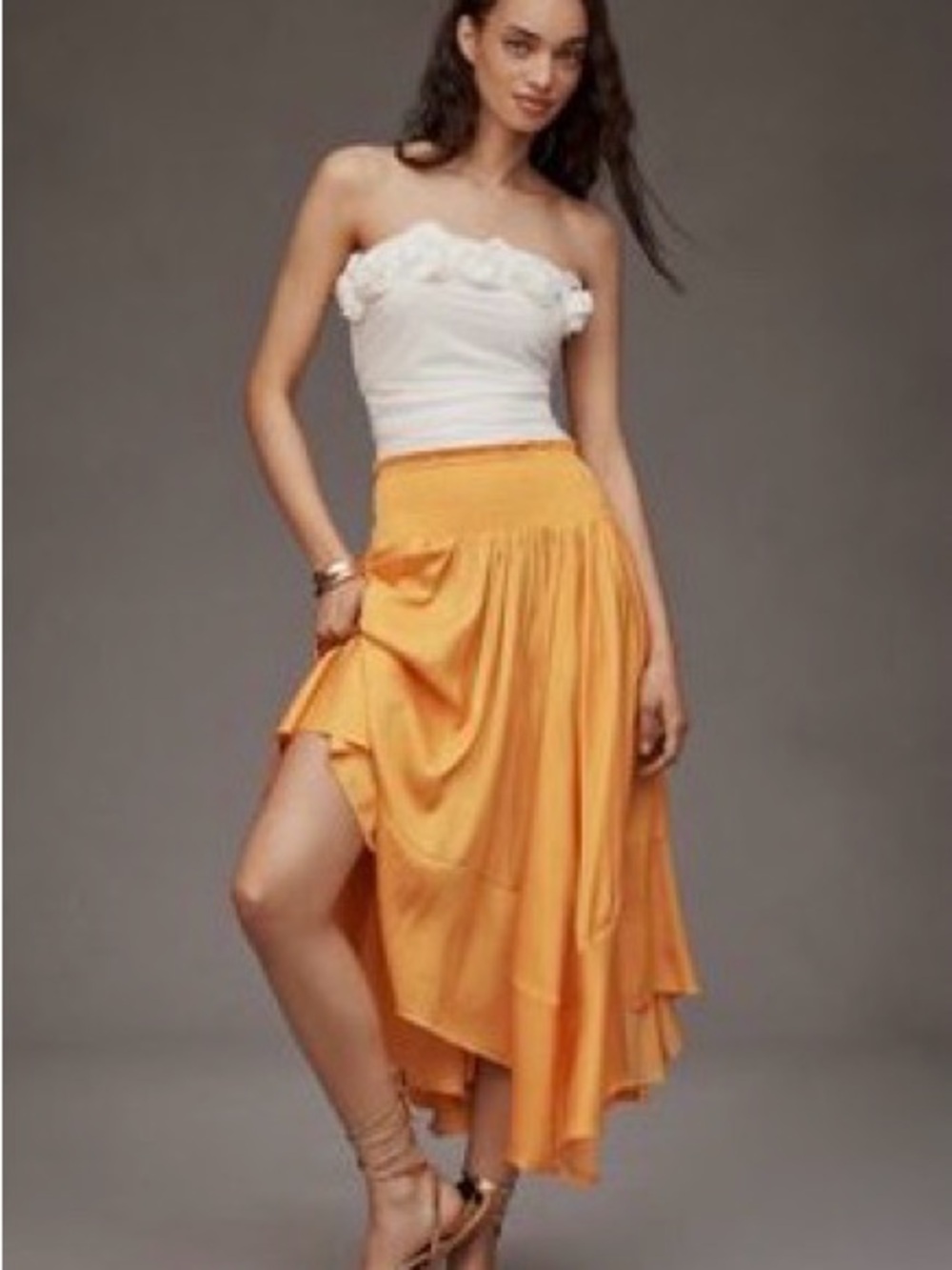 By Anthropologie Smocked-Waist Asymmetric Skirt. Color Radiant Marigold